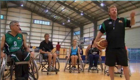 Paul Gooda on the court playing wheelchair basketball
