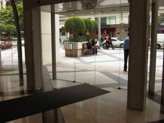 Glass doors and surrounding wall, no contrast strip provided for safety, unclear where doors are