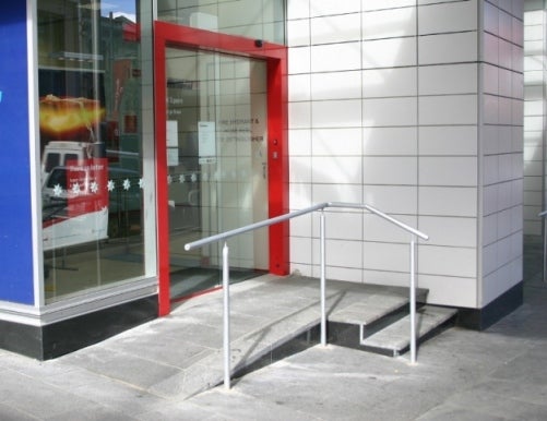 Non-compliant ramp, handrails, no TGSI