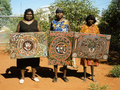 Image: L-R - Nola, Valerie and Margaret with paintings they did as part of their evaluation of the Grandmother's Program, 1997.
