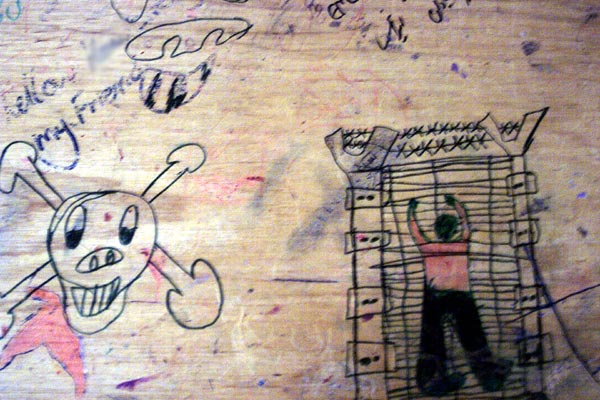 Drawings on a school desk at Port Hedland, June 2002.