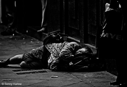 A homeless man sleeping on the street