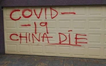 Racist graffiti: "COVID-19 China Die" spray painted on the garage of a Chinese family in Melbourne.